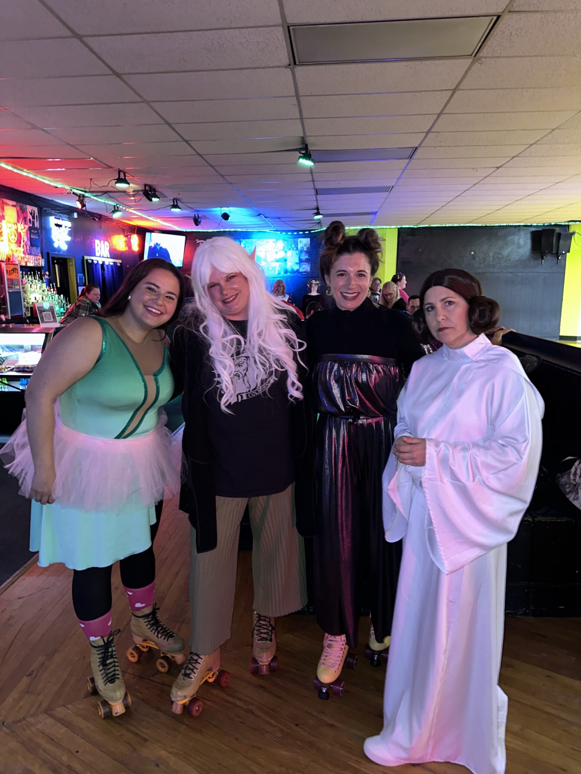 Group of people posing at Pride party in costume