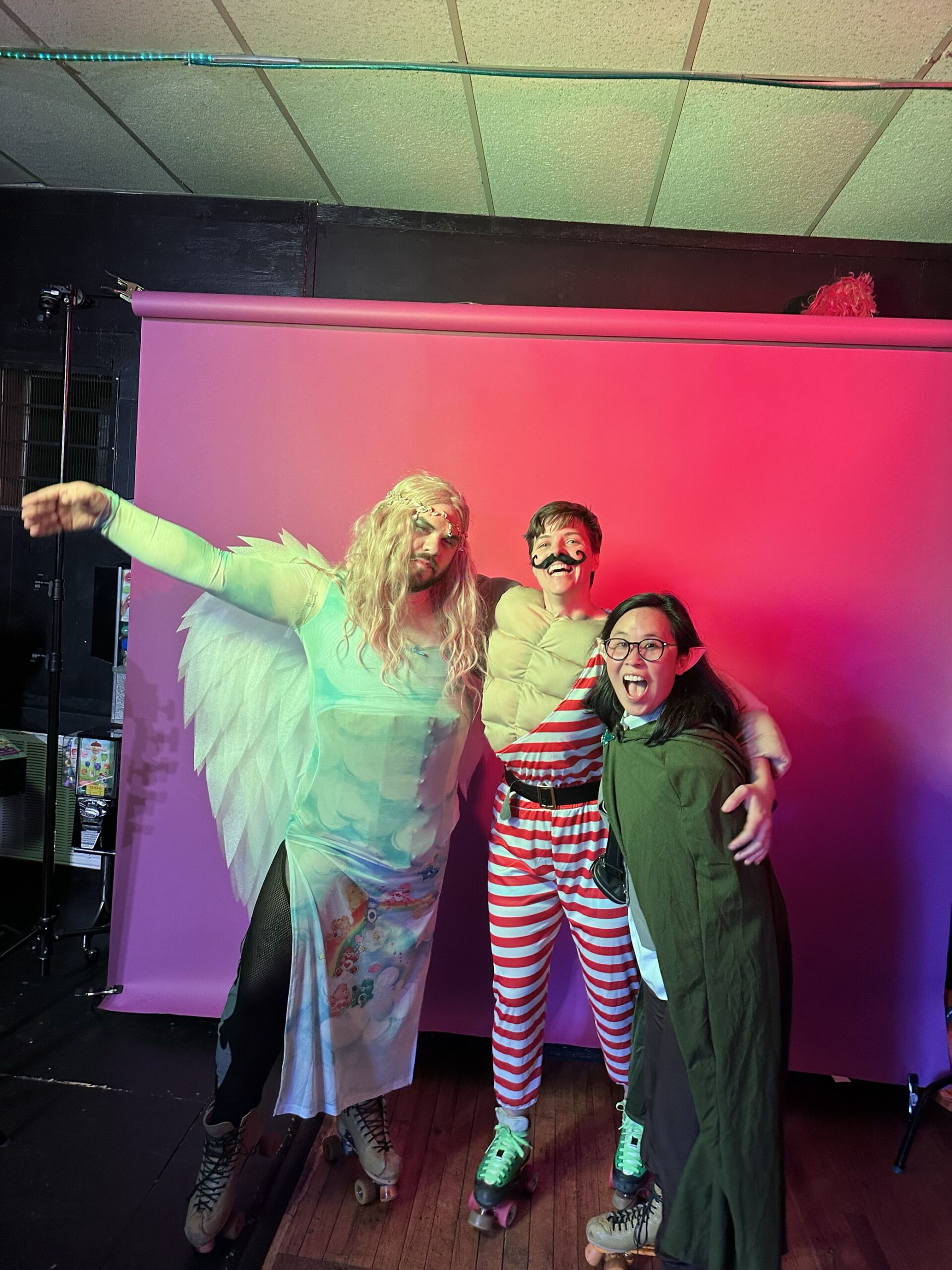 Group of people posing at Pride party in costume