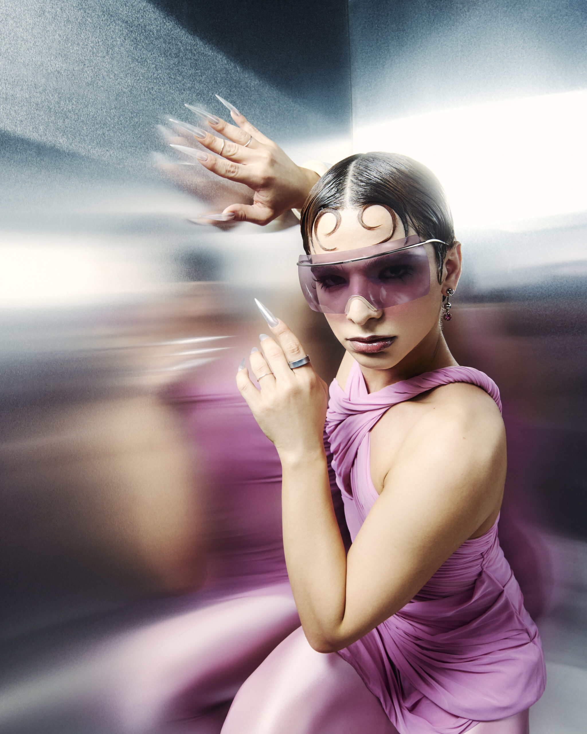 A woman in a pink dress with the Samsung Galaxy Ring