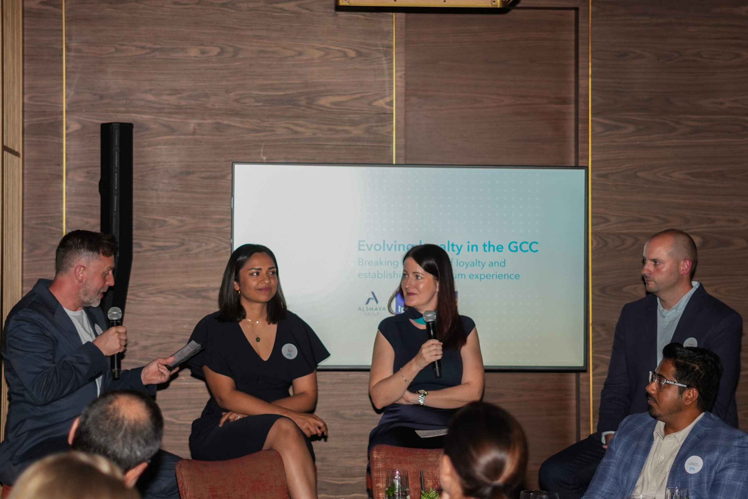 Four people speaking at the GCC panel discussion