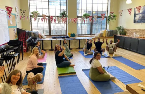 Employees enjoying their yoga session during Global Mental Health Day