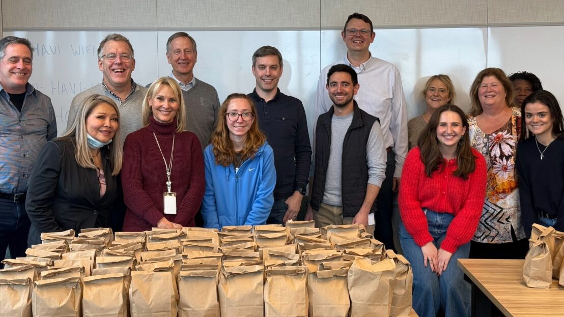 Group posing with bags for the Night Ministry